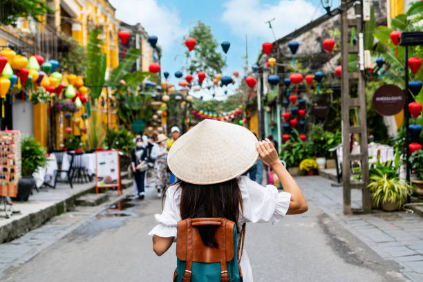 Woman walking in tropical rice terrace